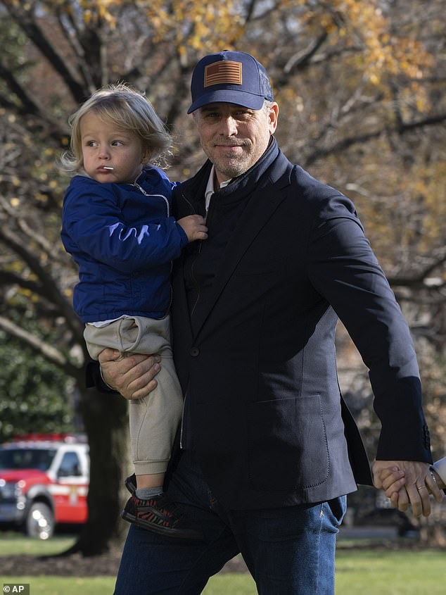 Hunter, 53, pictured here with son Beau Biden, Jr., 3,  has not provided ‘a single item or word of discovery’ in ongoing child support lawsuit with Lunden Roberts, the mother of his four-year-old daughter Navy Joan Roberts. Six months ago Hunter tried to recalculate the monthly amount he pays Roberts, 32