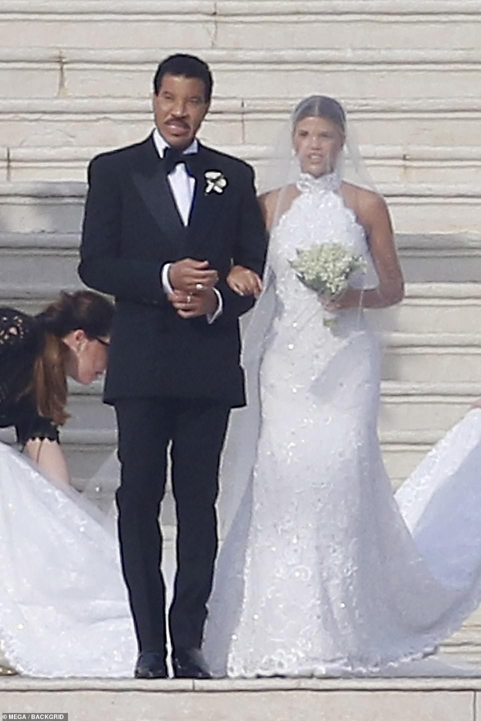 Blushing bride: Sofia Richie radiated beauty as she was escorted down the aisle by her father, music legend Lionel Richie, walked her down the aisle at the luxury Hotel du Cap-Eden-Roc in the French Riviera on Saturday