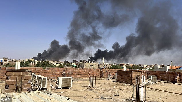 Smoke fills the sky in Khartoum, Sudan, near Doha International Hospital on Friday