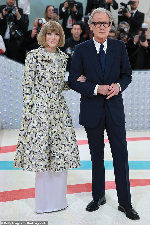 Anna, who has been hosting the event for nearly 30 years, donned a white, patterned Chanel couture dress on the carpet, while Bill opted for a simple, dark suit