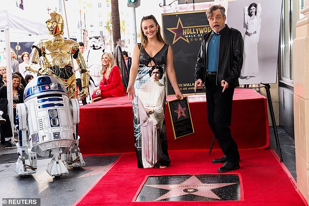 May the 4th be with her: Billie Lourd sported a dress featuring her mother's most iconic role and a heart-warming smile as she celebrated Carrie Fisher's life and career on Thursday with the unveiling of the late Star Wars actress' star on the Hollywood Walk of Fame